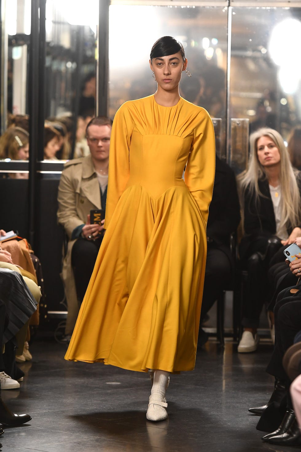 Fashion, Fashion model, Yellow, Fashion show, Clothing, Runway, Fashion design, Street fashion, Haute couture, Outerwear, 