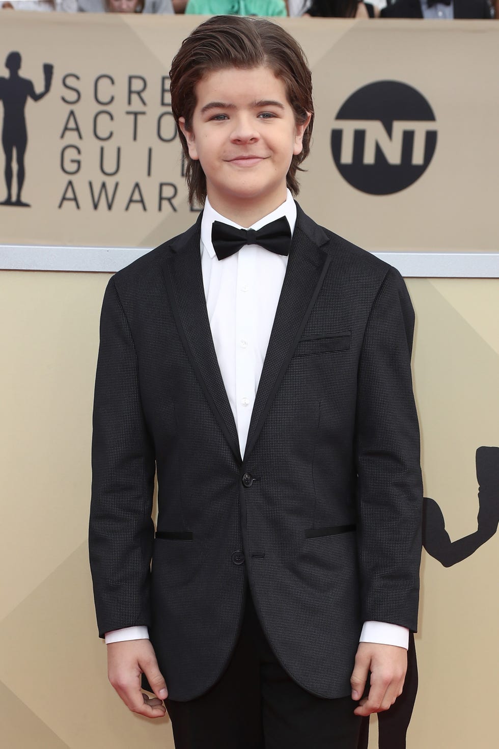 Suit, Hair, Clothing, Formal wear, Tuxedo, Hairstyle, Tie, Blazer, Premiere, Outerwear, 