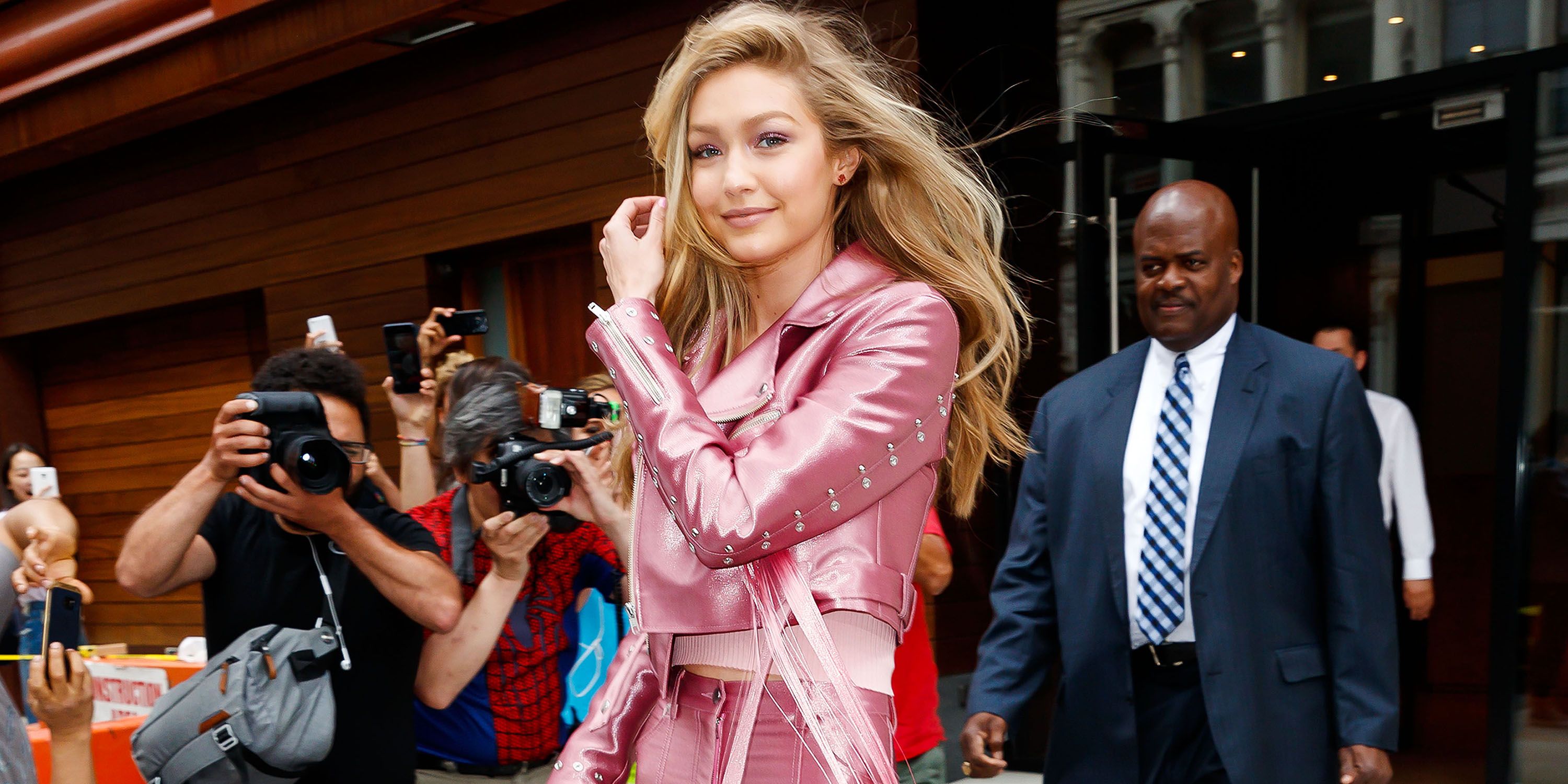 Gigi Hadid wore the hot pink pantsuit of our Barbie dreams, proving  millennial pink is so last season - HelloGigglesHelloGiggles