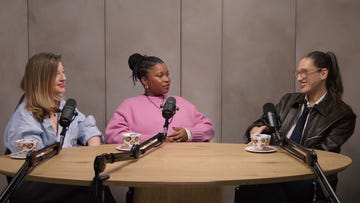 women engaged in a discussion at a podcast setup