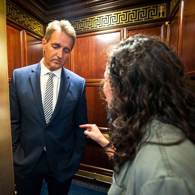 Protestor confronts Senator Flake in elevator after he announces he is voting to confirm Brett Kavanaugh nomination, Washington, USA - 28 Sep 2018