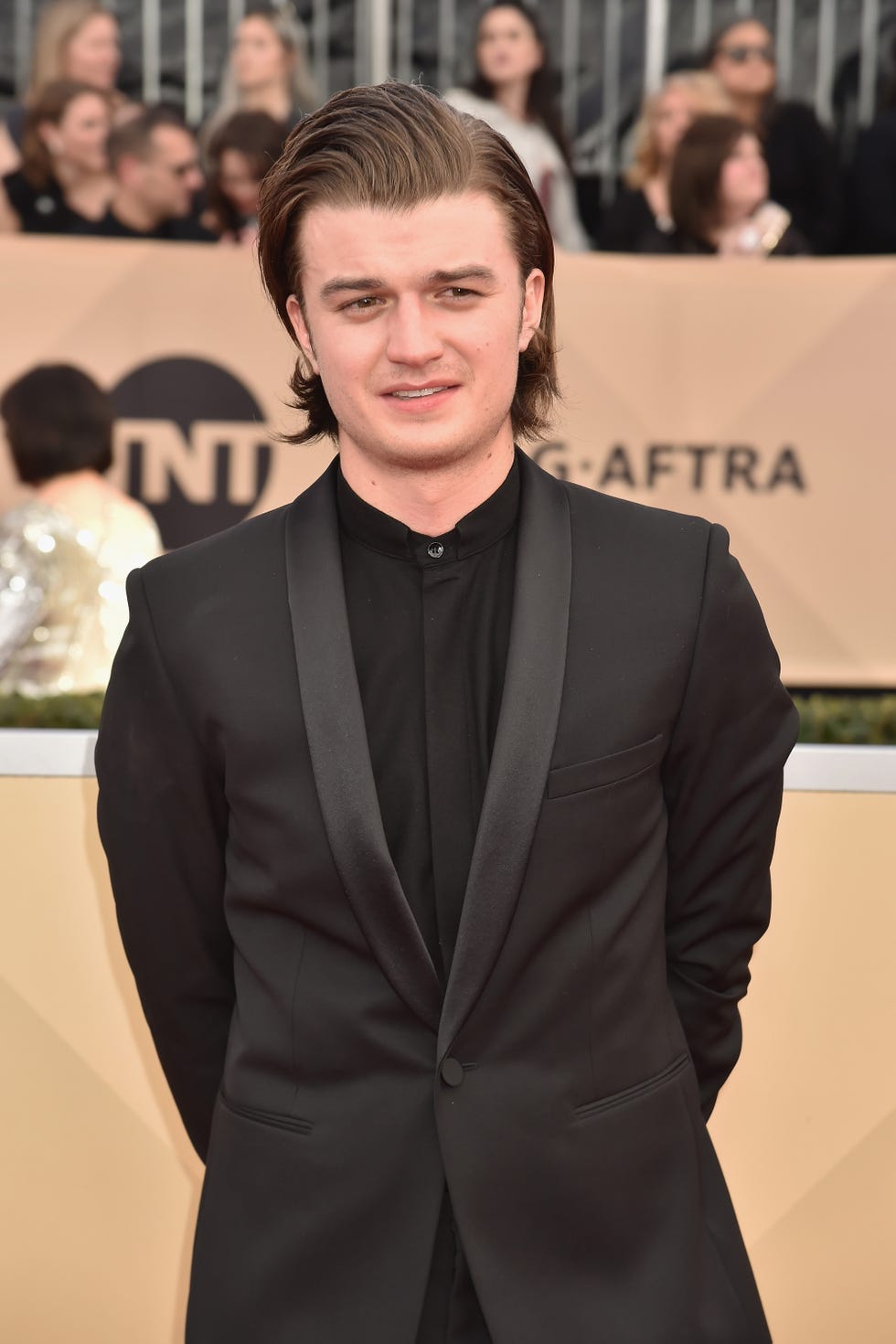 Suit, Hairstyle, Formal wear, Premiere, Fashion, Tuxedo, Carpet, Red carpet, Event, Flooring, 