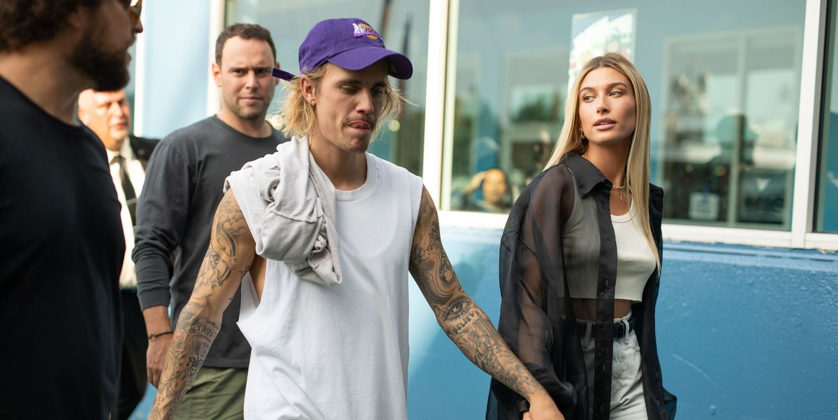 hailey baldwin and justin bieber are all smiles while justin shows off his  louis vuitton slippers as the couple stepped out in new york city-150219_5
