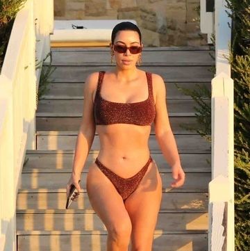 kim kardashian west sports a shimmering bikini at home