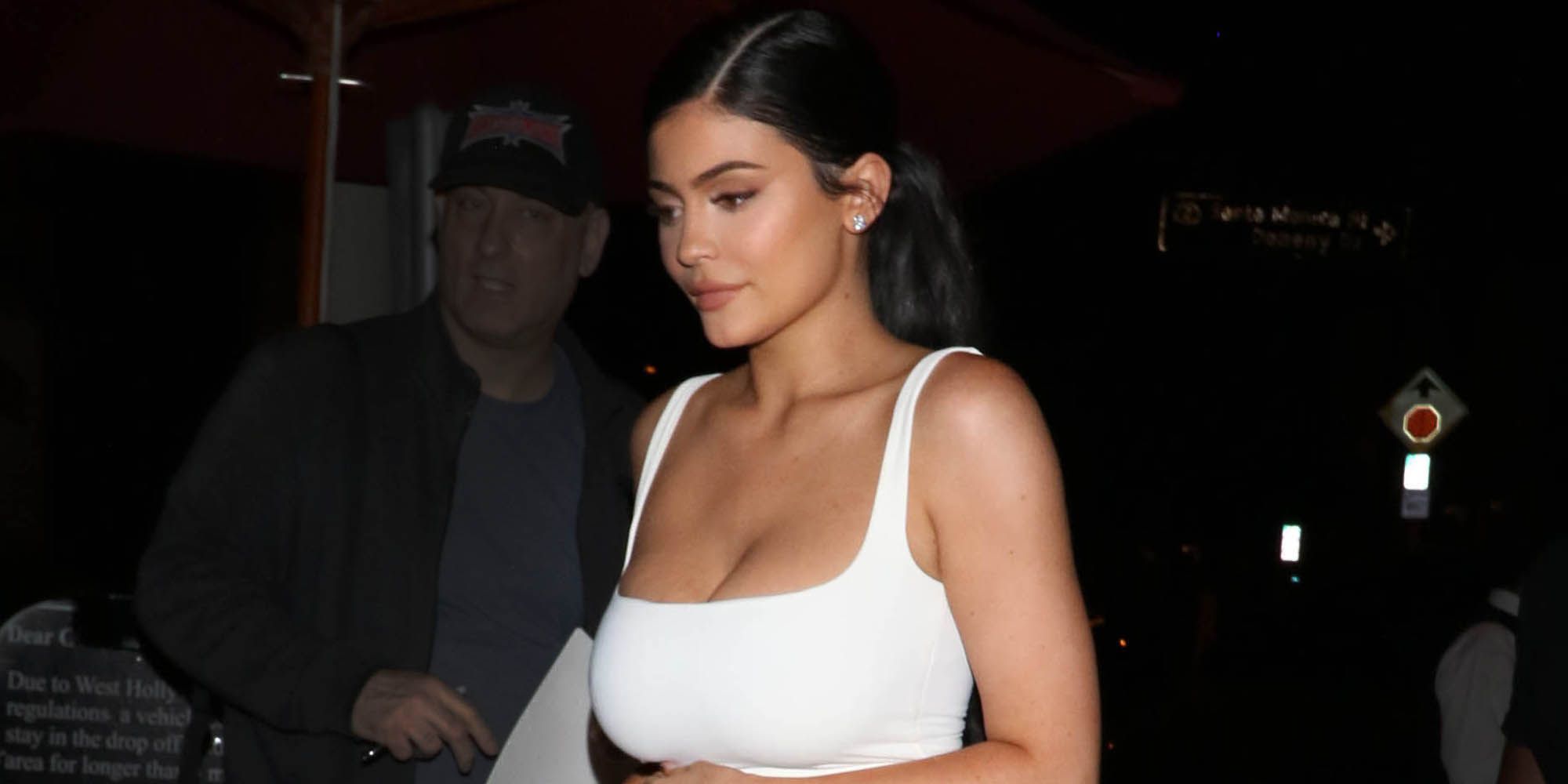 Kylie Jenner flashes her toned tummy during appearance with mask