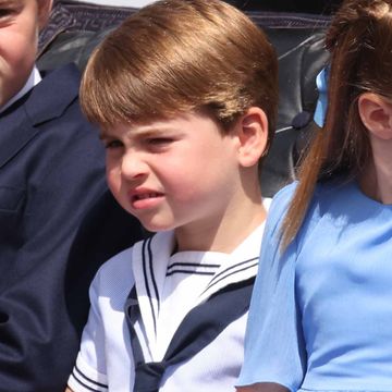 split image of young prince william and prince louis in sailor outfits