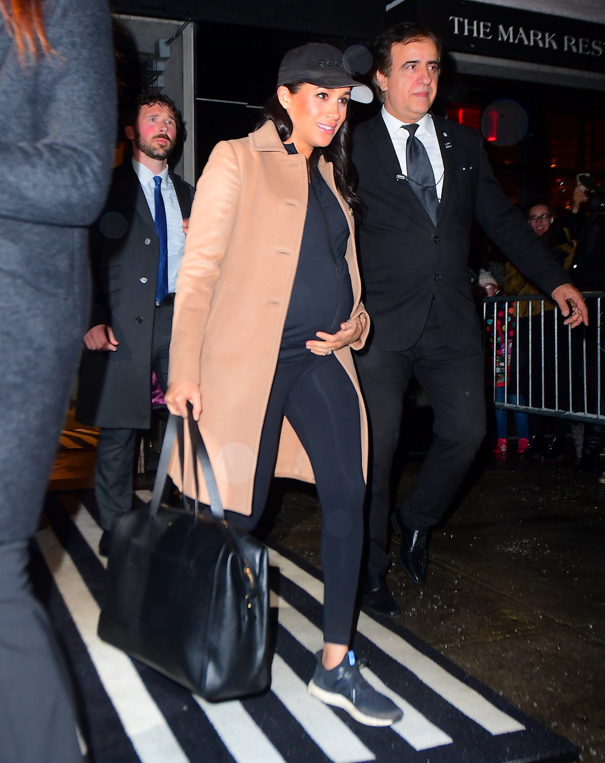 Meghan Markle Wears a Camel Coat and Workout Clothes While Leaving Her Baby  Shower