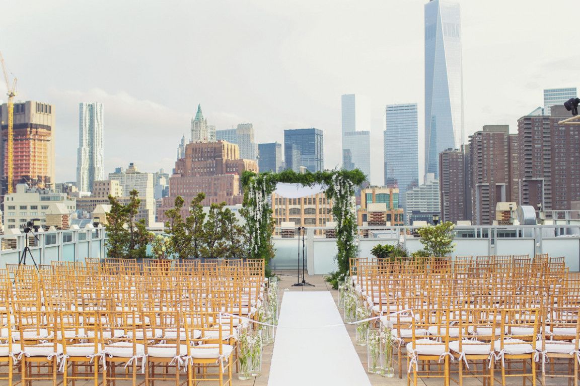 Wedding Ceremony in New York City with background of the new york skyline