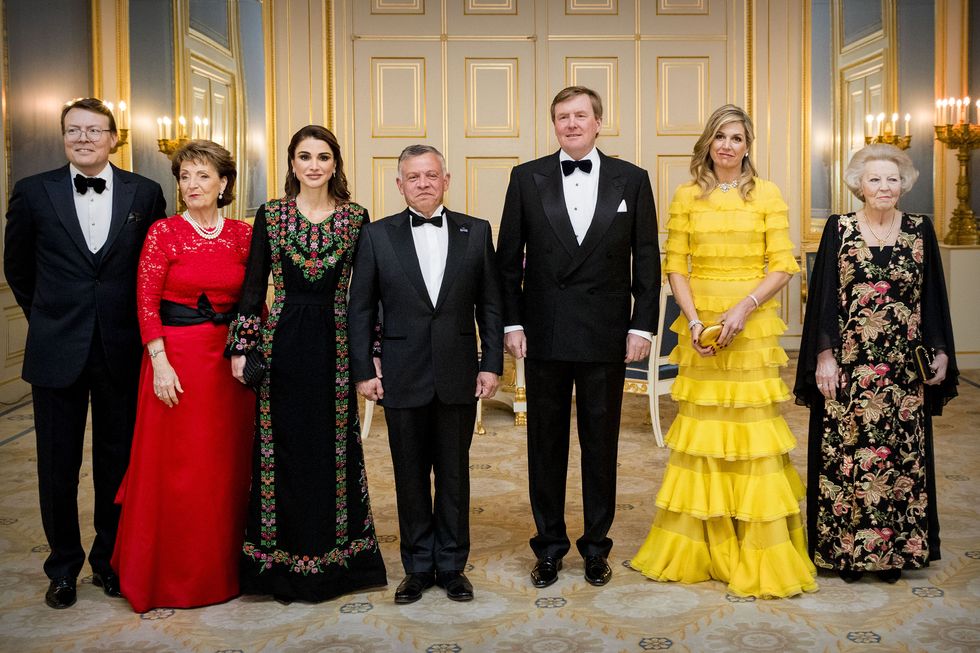 Yellow, Event, Fashion, Formal wear, Dress, Suit, Ceremony, Haute couture, Tourist attraction, Family, 