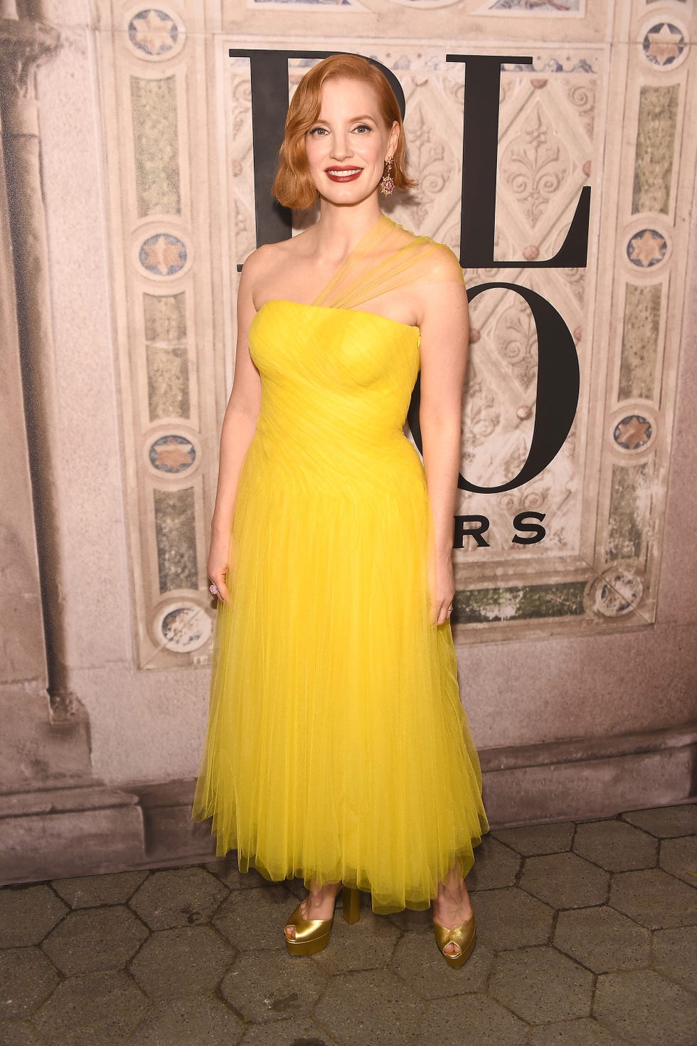 Dress, Clothing, Hair, Yellow, Shoulder, Cocktail dress, Strapless dress, Gown, Hairstyle, Fashion model, 