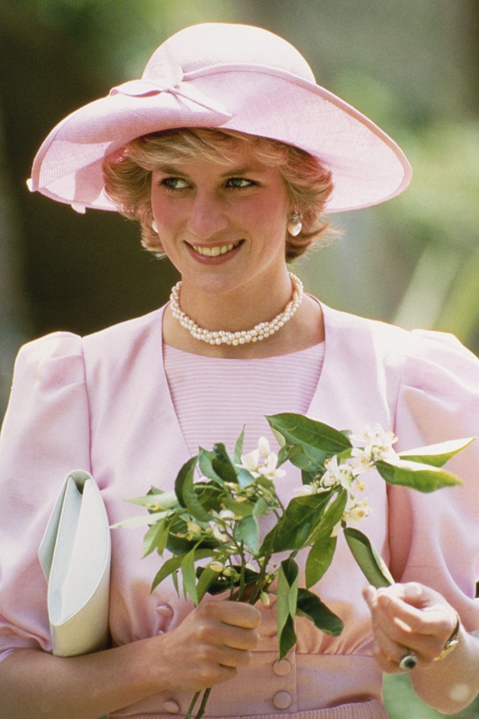 Hat, Botany, Sun hat, Smile, Headgear, Plant, Flower, Dress, Fashion accessory, Photography, 