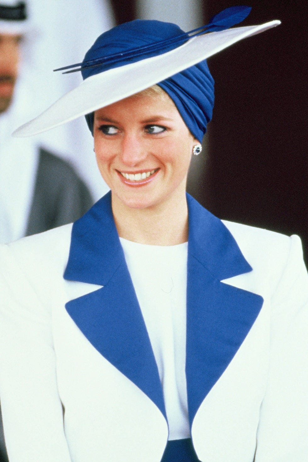 Blue, Clothing, Hat, Smile, Headgear, Electric blue, Fashion accessory, Academic dress, Costume hat, Sun hat, 