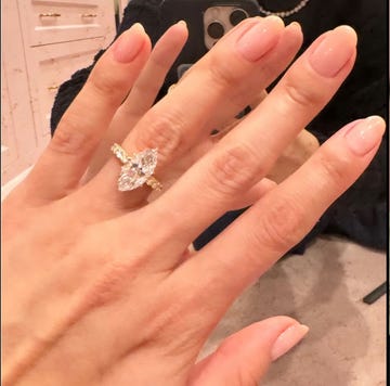 a hand displaying an engagement ring alongside a couple embracing a hand displaying an engagement ring alongside a couple embracing