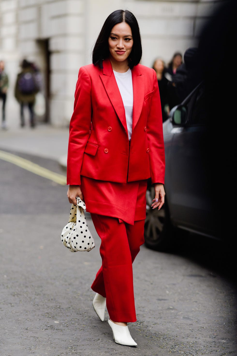 Clothing, Suit, Street fashion, Fashion, Fashion model, Red, Pantsuit, Outerwear, Blazer, Formal wear, 