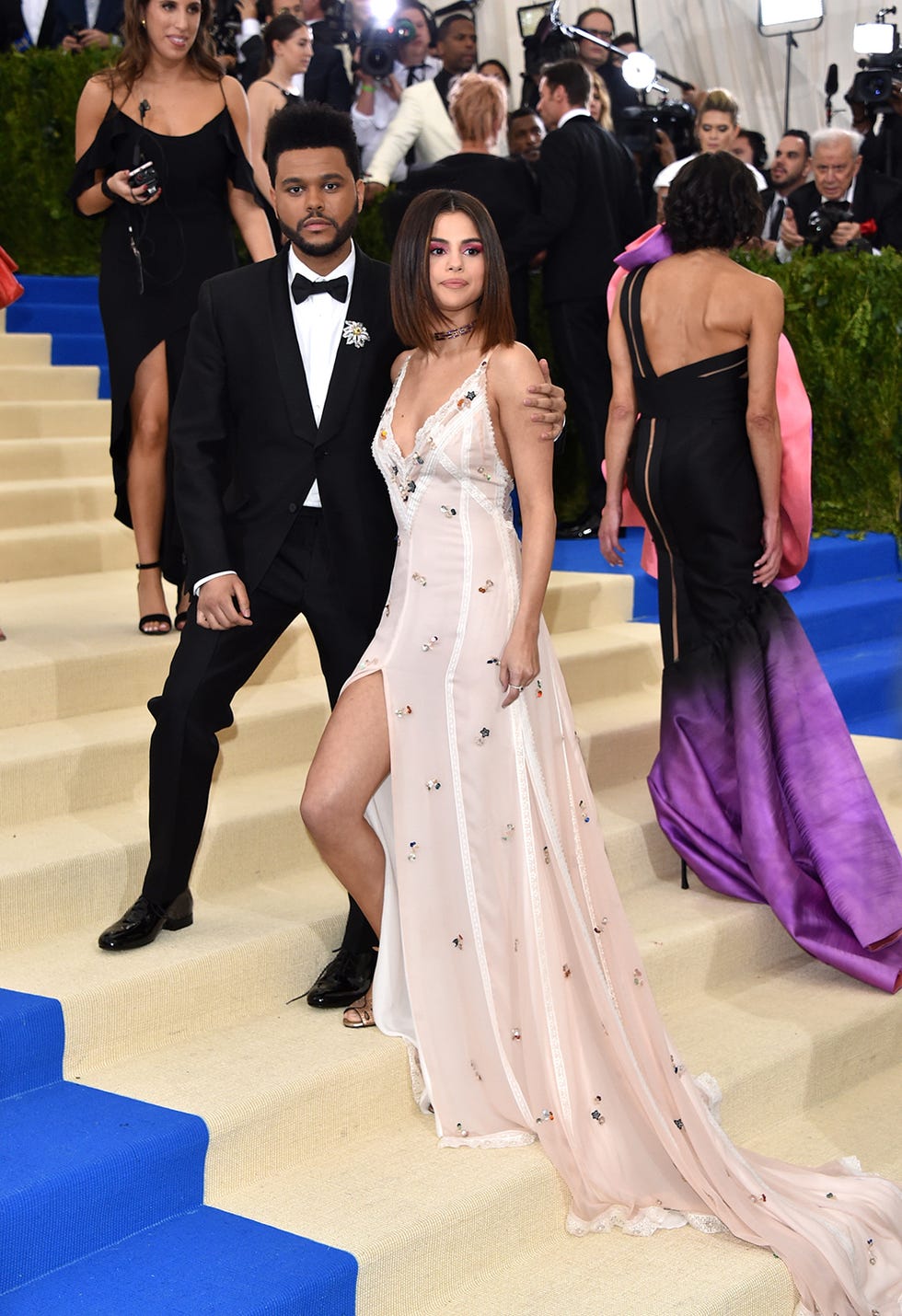 Selena Gomez Embraces The Weeknd During Their Red Carpet Debut at