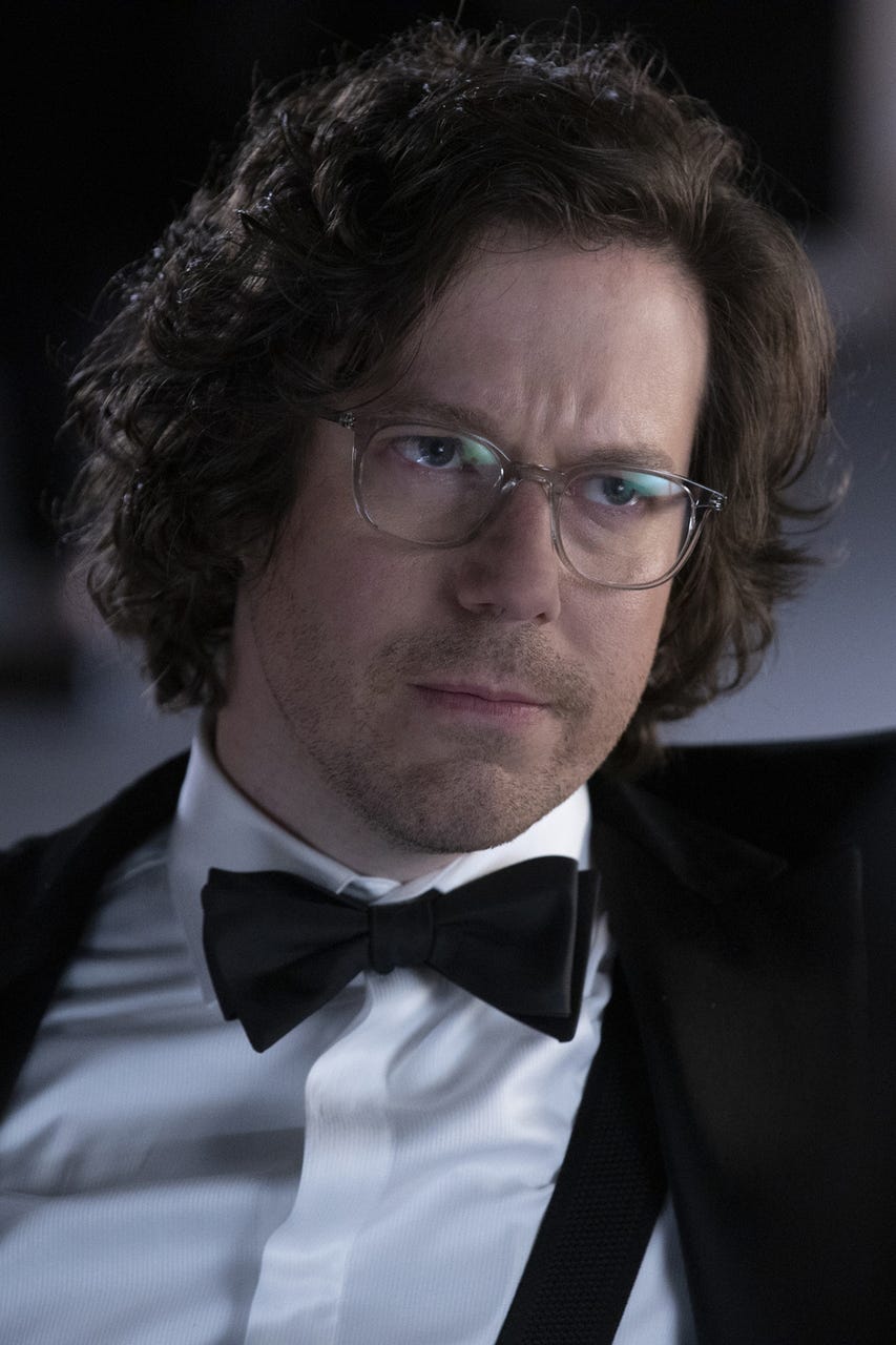 Suit, Tie, Formal wear, Tuxedo, Glasses, Chin, Bow tie, Forehead, Eyewear, White-collar worker, 