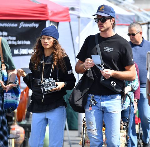 EXCLUSIVE: Zendaya and her boyfriend Jacob Elordi playing with cameras at a local flea market