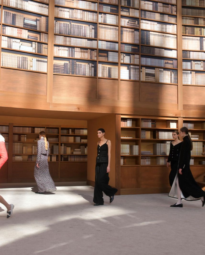 a group of people dancing in a library
