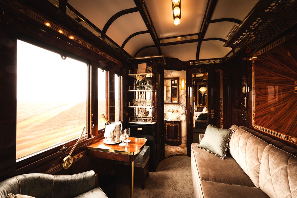 Luxurious train cabin interior with seating and bar