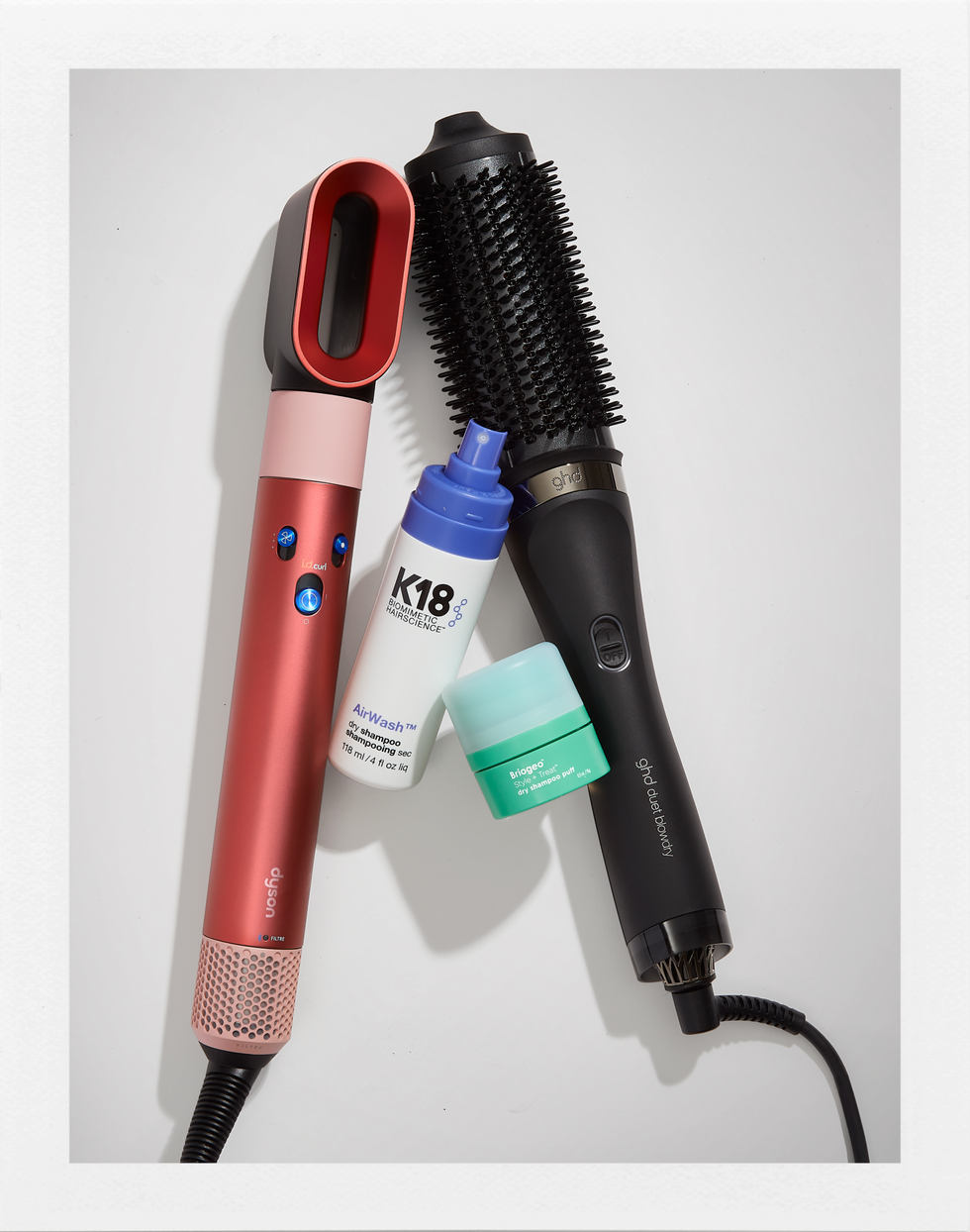 hair care tools and products including a styling tool dry shampoo and treatment
