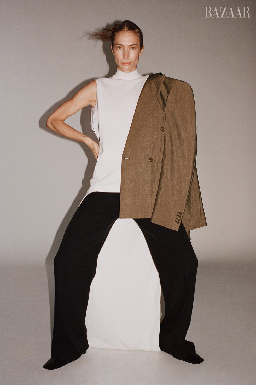 fashion model wearing a sleeveless top and oversized blazer with wideleg pants