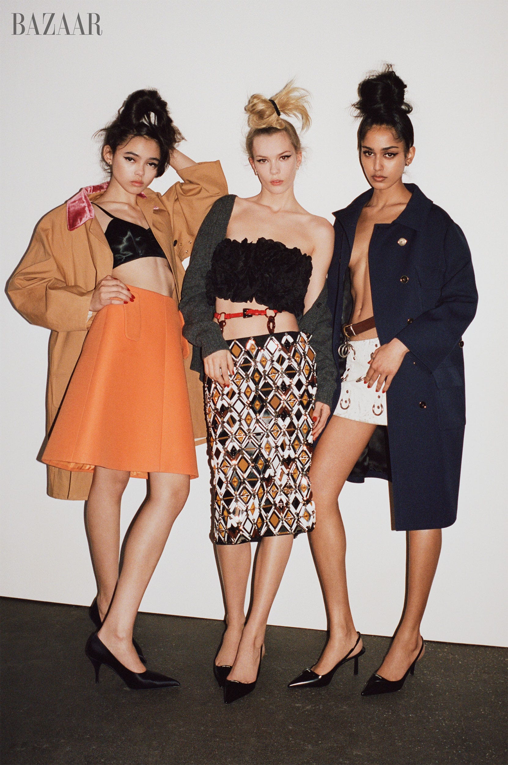 three models showcasing contemporary fashion styles