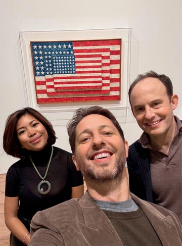 selfie in front of an american flag artwork