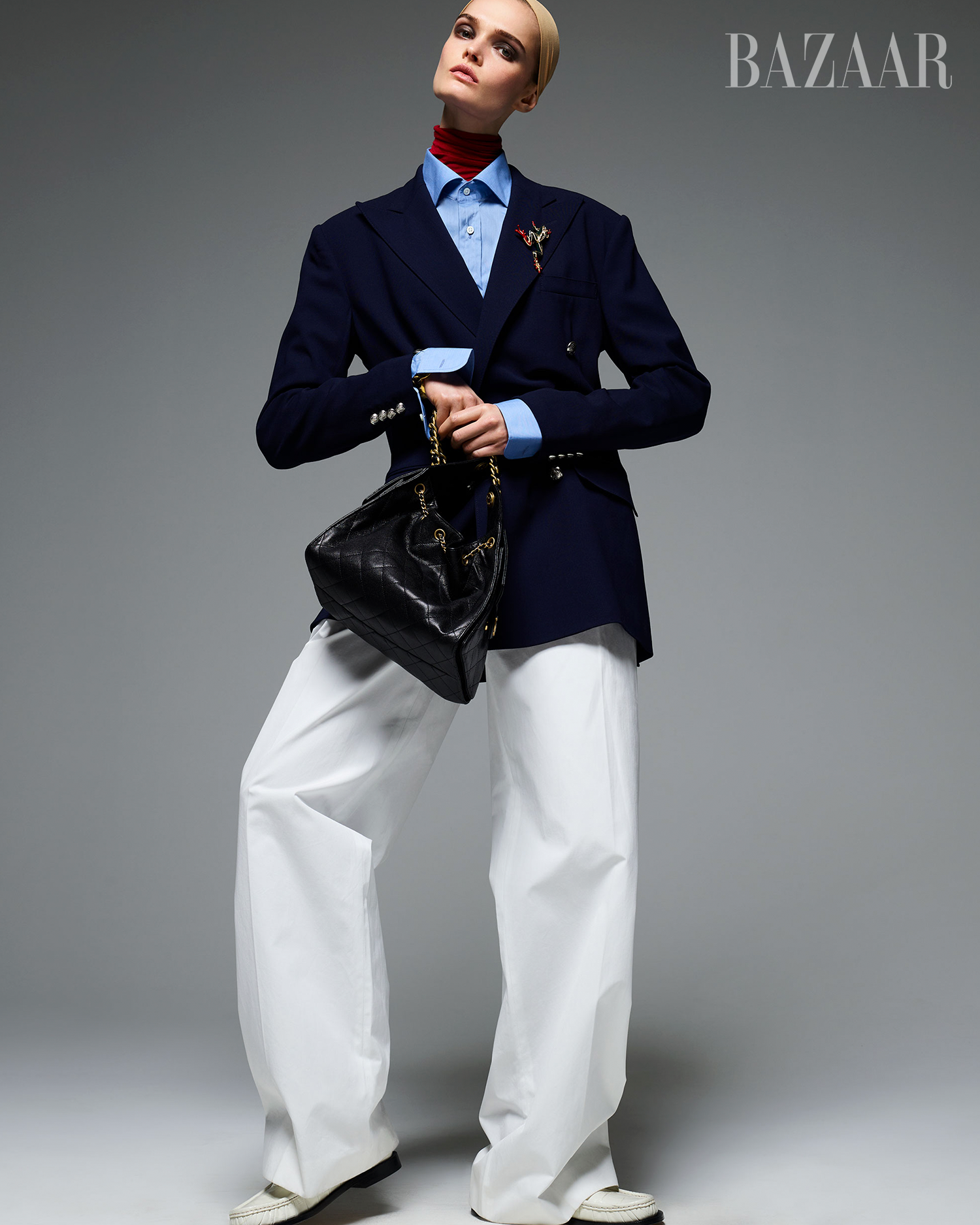 fashion outfit featuring a blazer oversized trousers and a handbag