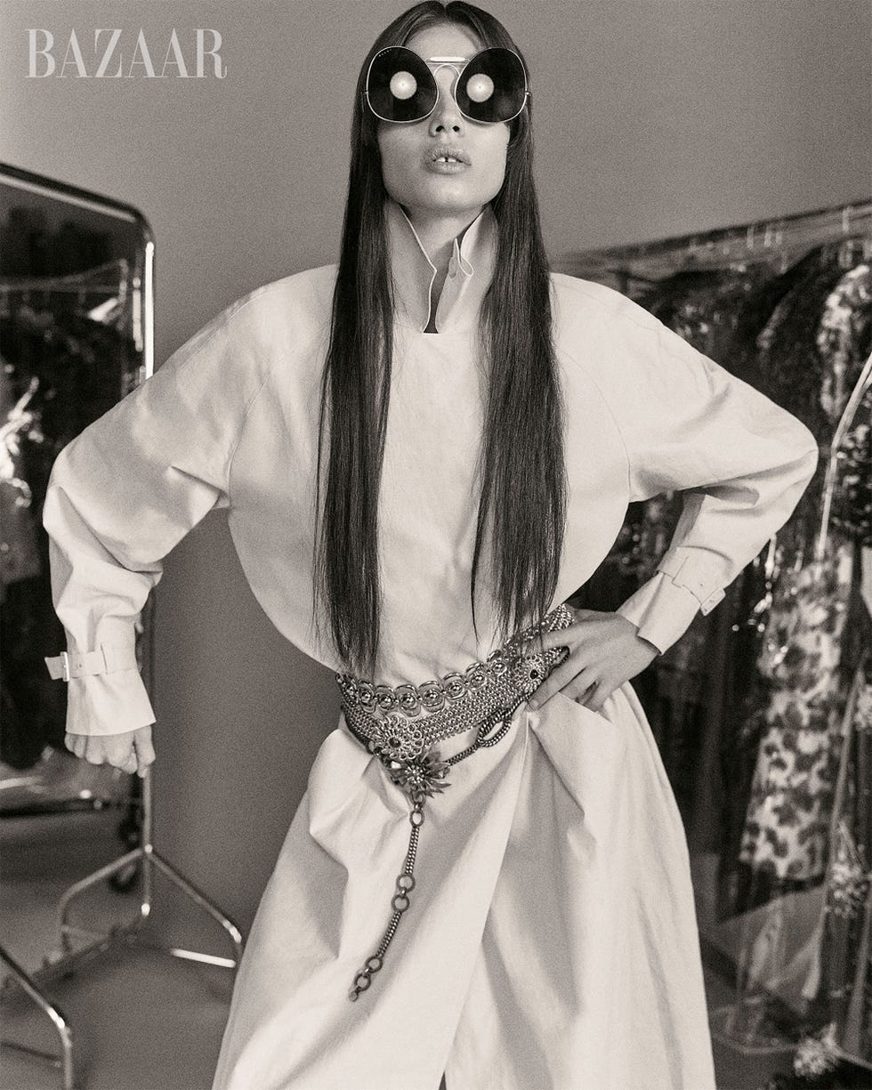 fashion model showcasing a modern outfit in a photoshoot setting