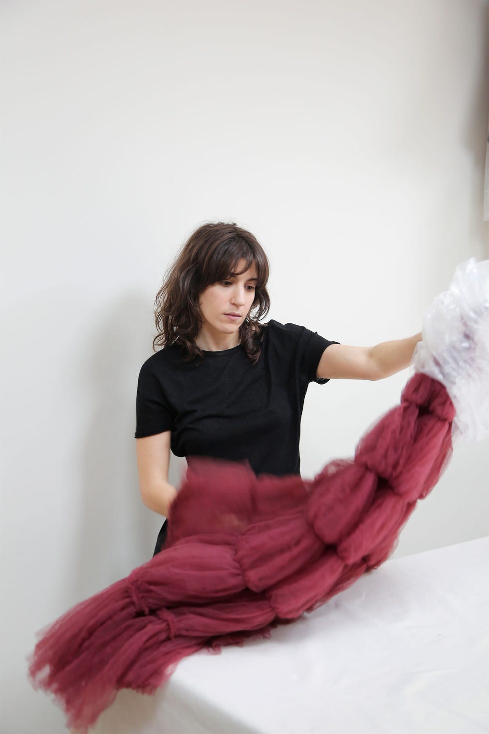 a person manipulating a piece of fabric