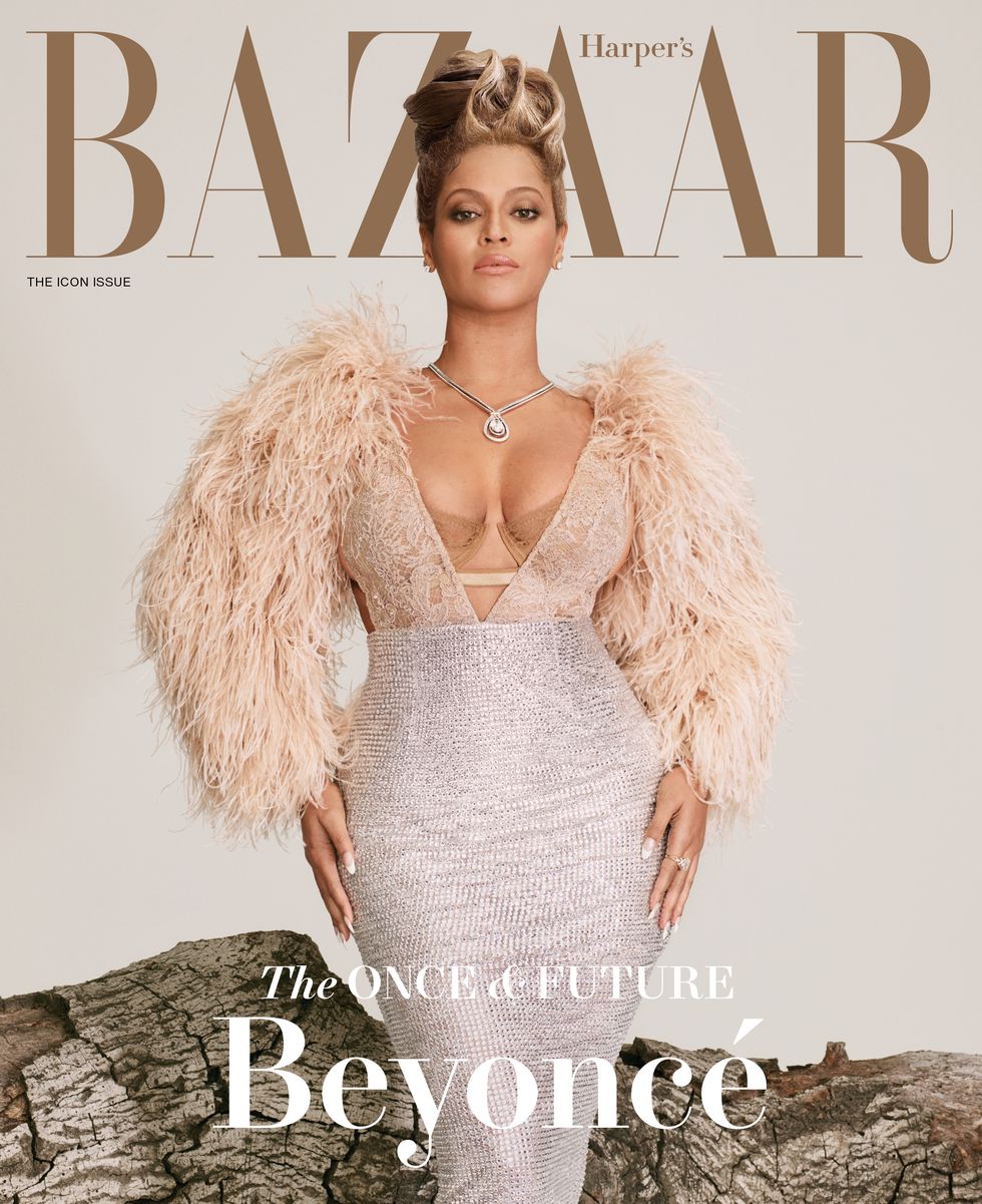magazine cover with beyonce standing in front of a log wearing a champagne gucci gown with feathered detailing at the top and diamond jewelry