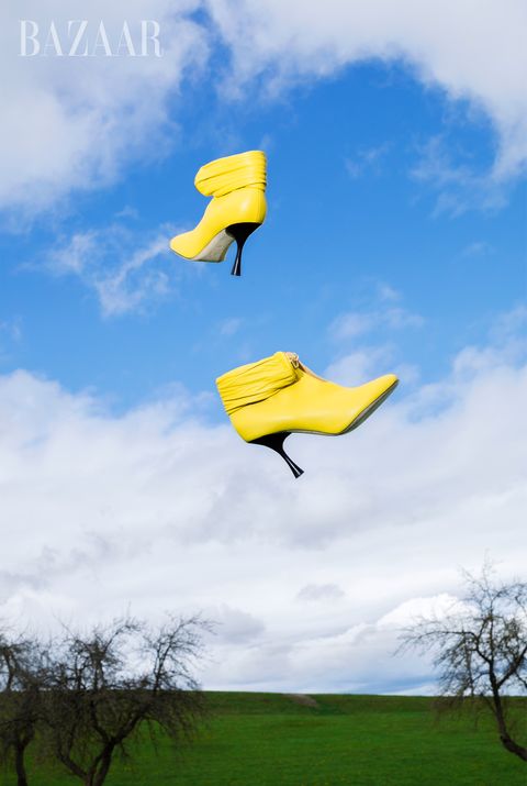 yellow boots over sky