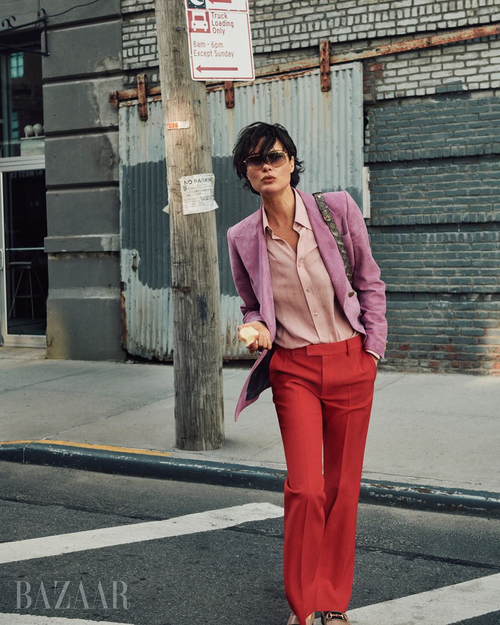 woman in pink blazer red pants