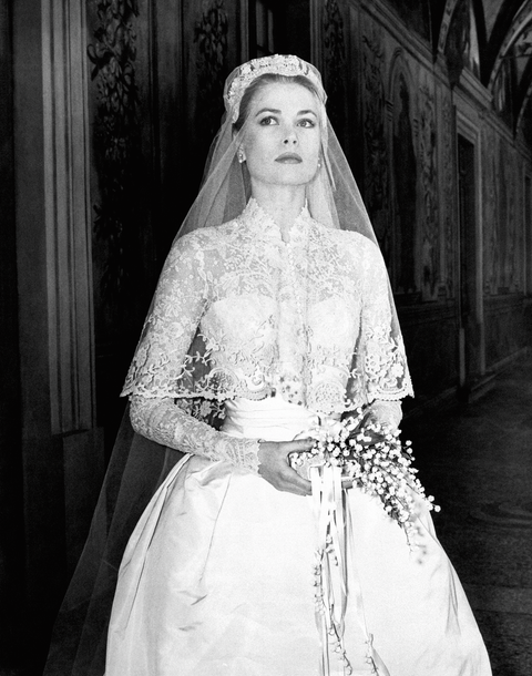 the big movie star grace kelly photographed in her bridal dress in a frescoed gallery within the prince's palace, just before the wedding ceremony where she will marry ranier iii of monaco, becoming princess of the principality monaco, april 18th, 1956 photo by mondadori via getty images