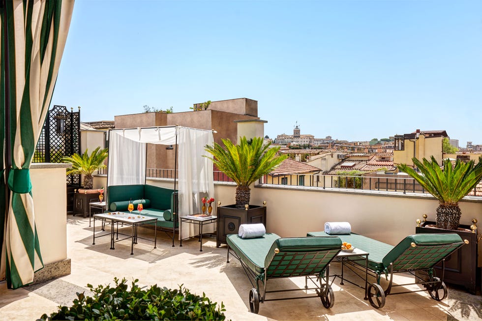 Rooftop terrace with seating area drinks and city view