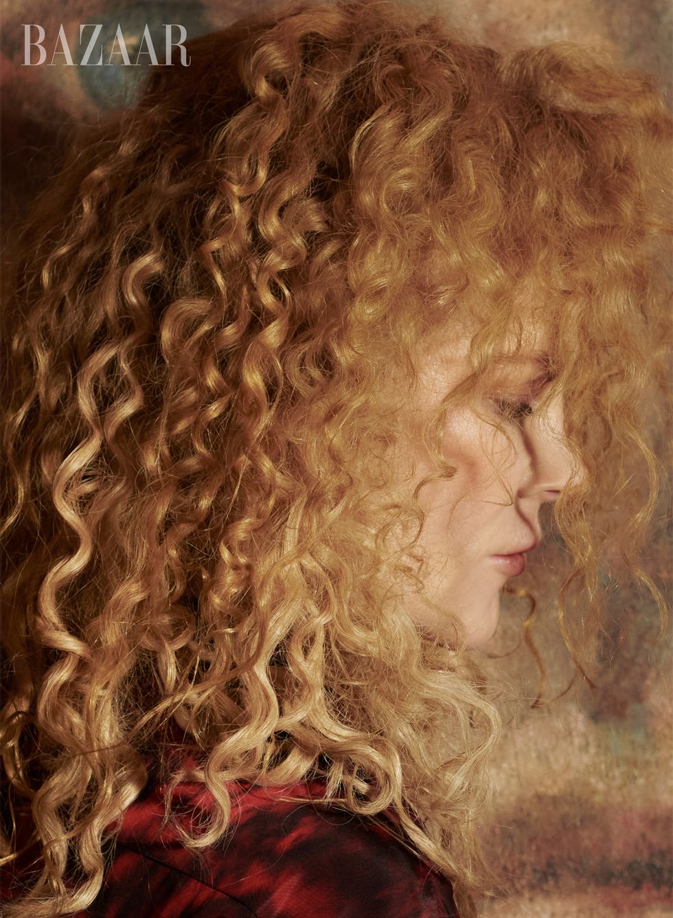 side profile of nicole, whose face is covered by her curls