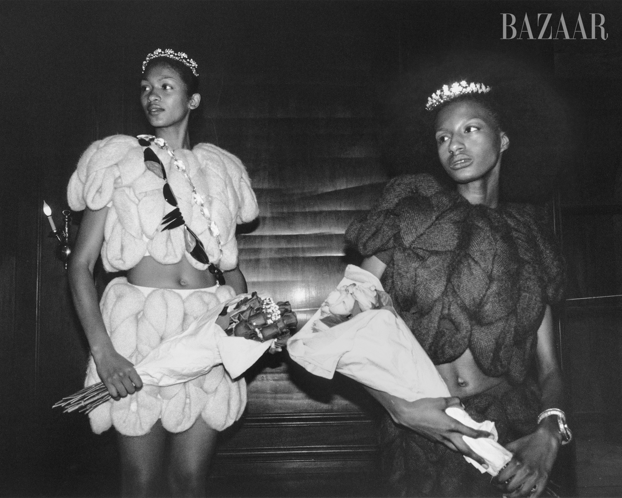 top and skirt, jw anderson tiara, jennifer behr necklaces worn around chest, alexis bittar on right top and skirt, jw anderson tiara, jennifer behr bracelet, schiaparelli