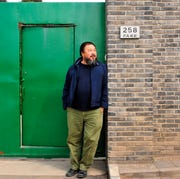 This is an image ai weiwei outside his studio in caochangdi beijing