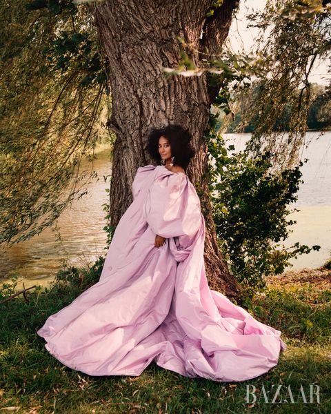 tracee ellis ross poses in a pink schiaparelli haute couture﻿ dress and earrings