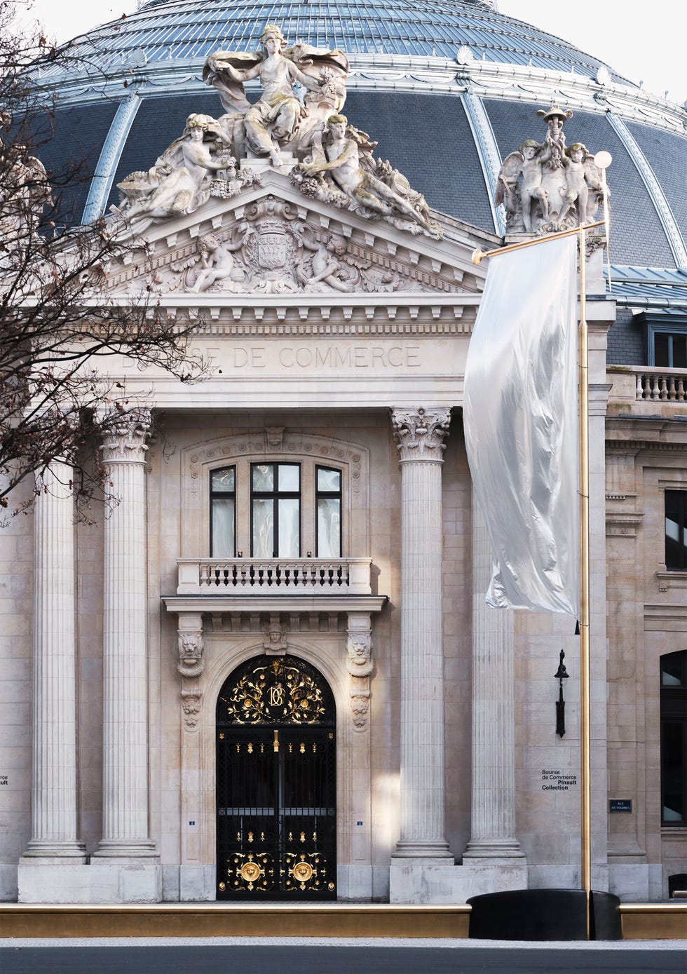 Historical building facade featuring ornate architecture and a grand entrance