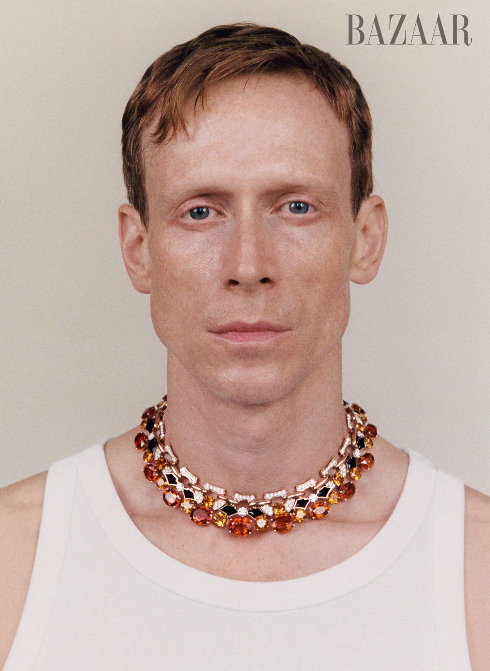 a person wearing a decorative necklace with colorful gemstones