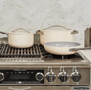 a stove top with pots and pans on it