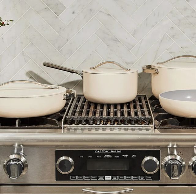 a stove top with pots and pans on it