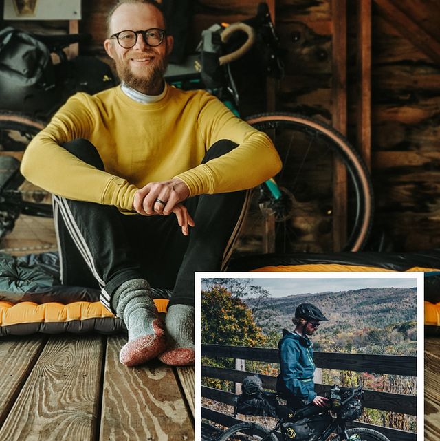 ryan keggs sitting down and with his bike at an overlook