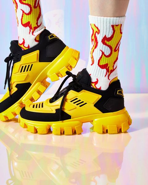 Footwear, Yellow, Shoe, Boot, Ski boot, Action figure, Athletic shoe, Toy, 