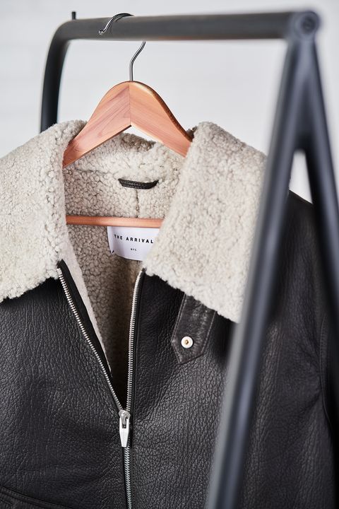 White, Clothing, Clothes hanger, Outerwear, Sleeve, Jacket, Sweater, Leather, Button, Top, 