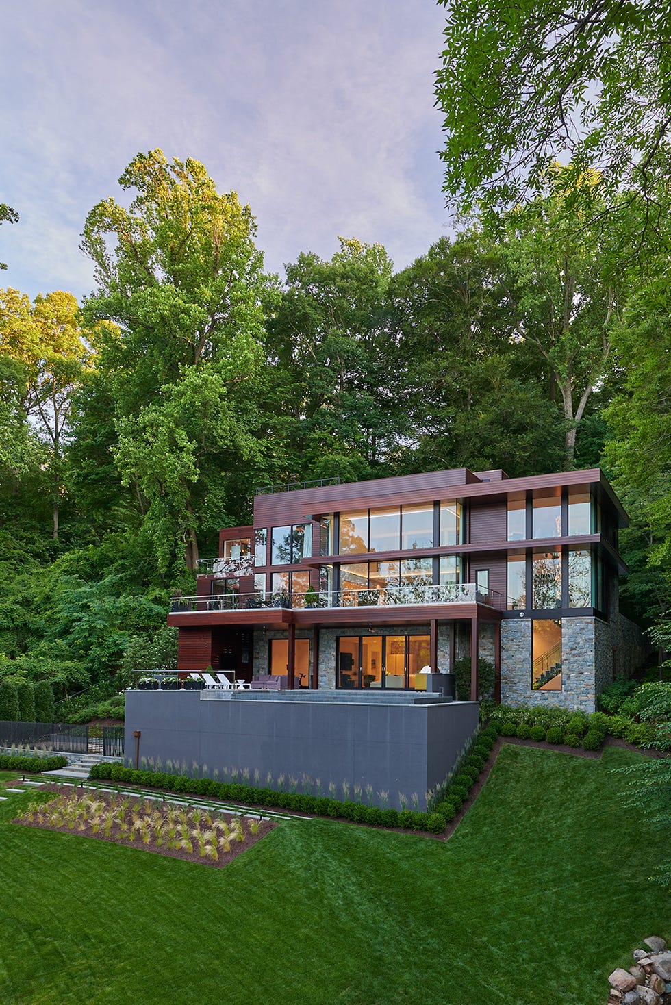 a house surrounded by trees a house surrounded by trees