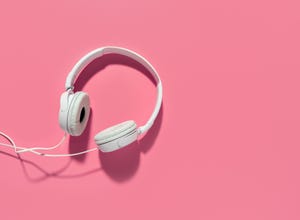 headphones on pink background