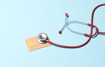 conceptual image of a stethoscope on a credit card, could illustrate ideas around health of ones credit score or economy