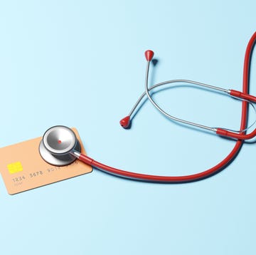 Stethoscope checking health of Credit card conceptual image of a stethoscope on a credit card, could illustrate ideas around health of ones credit score or economy